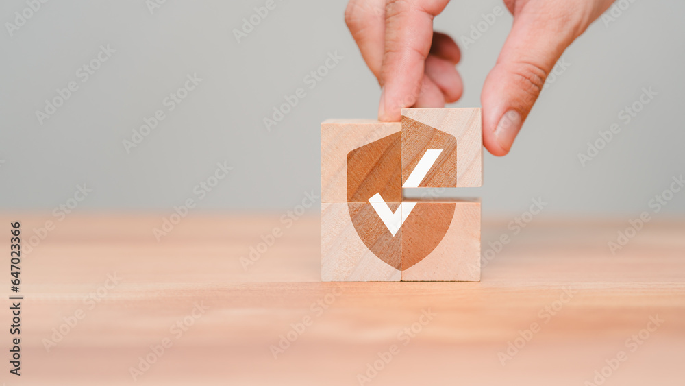 Leinwandbilder hand put a wooden cube block with identity proof icon for security protection system on wood table. 
