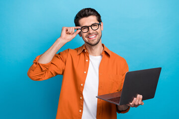 Photo of positive intelligent lawyer toothy smile arm touch eyeglasses hold netbook isolated on...