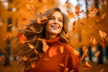 Fototapeta premium A beautiful girl throwing leaves in the forest, as the autumn season is approaching