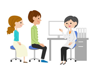 診察室で女性医師に説明を受ける若い夫婦