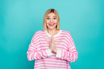 Photo of shiny excited girl dressed striped sweater arms together asking buy new clothes isolated...