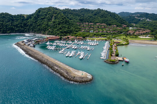 Beautiful aerial view of the Los Sue&ntilde;os Marina full with yachts and boats in Herradura Beach - Costa Rica