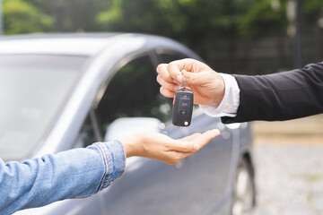 Business car rental, sell or buy service, dealership hand of agent dealer, sale man giving auto key...