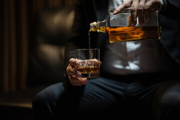 Businessmen in suits drinking  Celebrate whiskey.