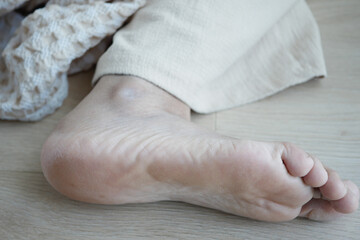 close up of young women dry feet on floor 