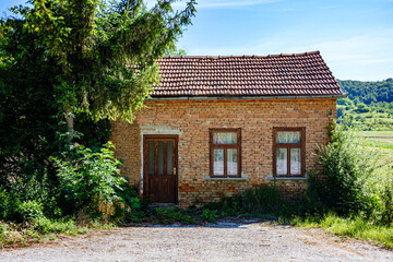 abandoned house in a poor part of northern Croatia, summer, noon