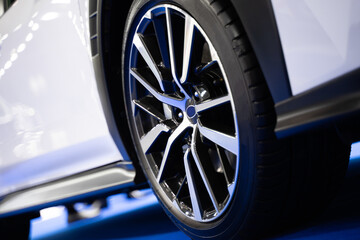 Naklejka premium Details about the wheels of a white super sports car, luxury car