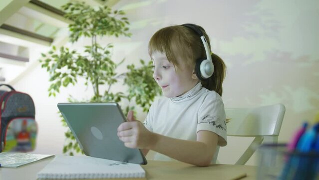 Digital Natives. Small Child Hold Pad Computer Surfing Internet Play Game At Home . Watching Video Internet Education Concept.