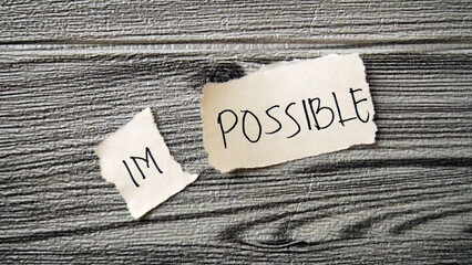Im Possible. I can, goal achievement, possible, potential, real overcoming. unpossible is believable with wooden texture background