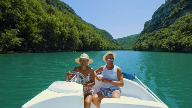 Le Verdon Gorge or Gorges Du Verdon lake of Sainte Croix, Provence, France, Alpes Cote d Azur, blue green lake with boats in France Provence. Europe couple men woman mid age on vacation Provence 