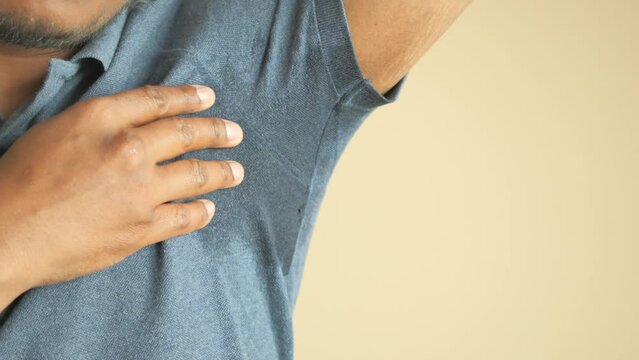 man with wet armpits Smelly odor from sweat .