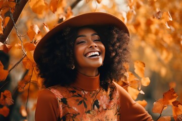 Beautiful smiling black woman walking in the park with autumn leaves, fashion