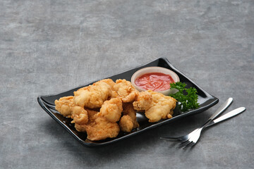Crispy chicken fillets (ayam goreng tepung) with chilli sauce
