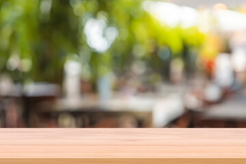 Wooden board empty table background. abstract blurred cafe background