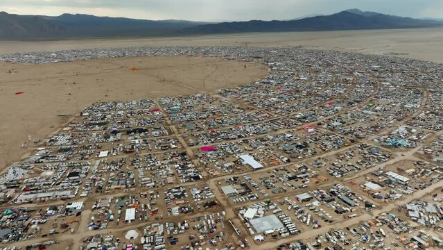 Aerial pan shot overlooking camping area at the Black Rock City, in Nevada, USA