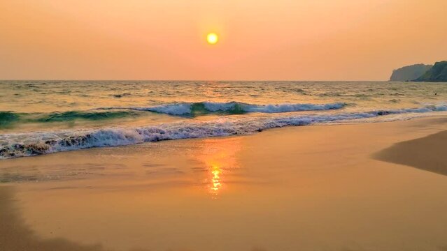 Sunset at the beach of the tropical island Koh Lanta Krabi Thailand, evening on the beach calm scenery