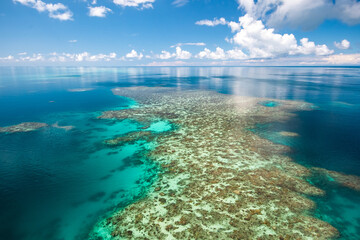 Coral reef from the helicopter on a sunny day and low wind