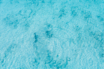 Fototapeta na wymiar Tropical beach water with crystal clear water on beach background