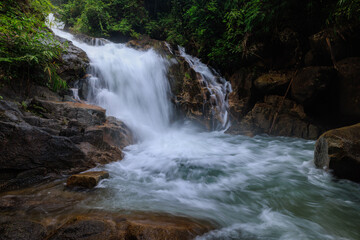 Fototapeta na wymiar Krating waterfall in the rainy season and refreshing greenery forest in the national park of Khao Khitchakut Chanthaburi province Thailand, for background wallpaper,