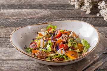 Salad with duck meat, vegetables and cheese. Autumn salad with pumpkin