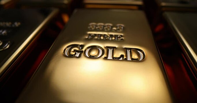 Gold bars stacked in row. Engraving on gold 999.9 purity and net weight 1000 g