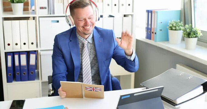 Smiling businesswoman is remotely assessed in English at workplace in office. Remote learning of foreign languages