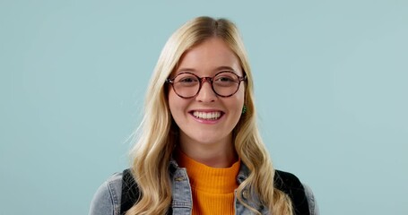 Happy woman, glasses and vision, face and smile for eye care with health isolated on blue background. Optometry, frame and prescription lens for designer eyewear, eyesight improvement in studio