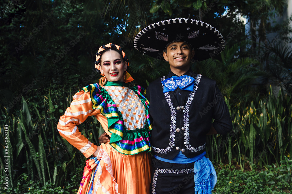 Wall mural latin couple of dancers wearing traditional mexican dress from mexico latin america, young hispanic 