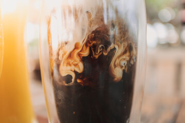 Iced latte coffee and mango juice drinks in concept of summer.