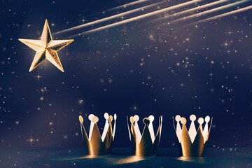 three shiny crowns and a star in the sky. Epiphany and three kings day holiday celebration night...