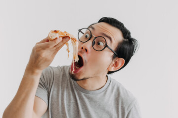 Funny face nerd man has cheesy pizza isolated on white background.