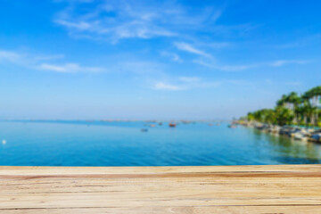 Empty wooden table and tropical beach view
