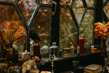 Halloween party decor in gloomy dark colors with the table is set