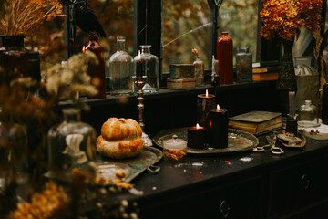 Halloween party decor in gloomy dark colors with the table is set