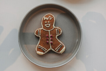 Gingerbread man cookies served in grey dish.