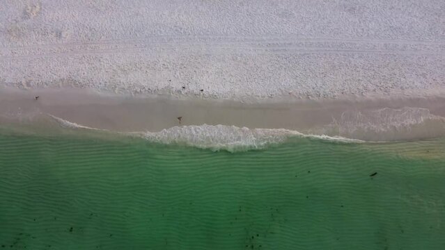 Okaloosa Island with an empty Beach during morning in Destin Fort Walton Beach, Florida. Aerial view of beach shore okaloosa island Gulf of Mexico. Doris Jordan Freeway Beachwalk sunrise view.
