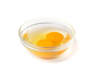 Two Broken Eggs in Bowl Isolated, Raw Yolk and White, Fresh Broken Organic Chicken Eggs