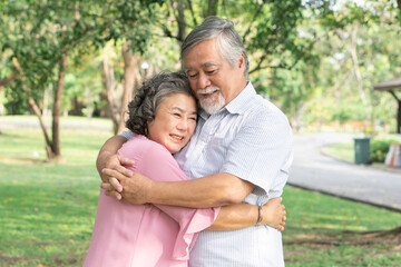 Fototapeta premium Asian healthy senior couple relaxing in the park together.