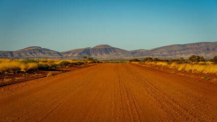 Fototapeta na wymiar Unsealed Nanutarra-Munjina dirt road in rural WA, Australia