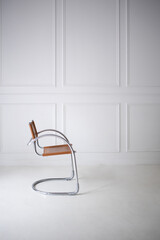 modern minimalistic metal chair on white background