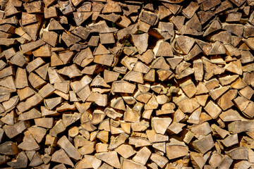 Stack of chopped firewood for wooden background