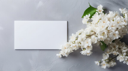 Blank greeting card in frame made of white jasmine