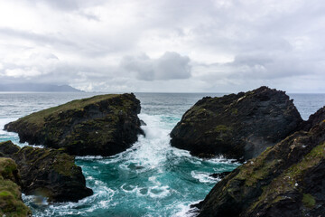 Fototapeta na wymiar View of the cliffs of Punta Herbosa, near Esteiro beach, with waves. O Barqueiro, A Coruña, Spain.