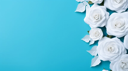 Obraz na płótnie Canvas Arrangement of beautiful roses. White paper frame on blue background