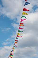 colorful flags against the blue sky