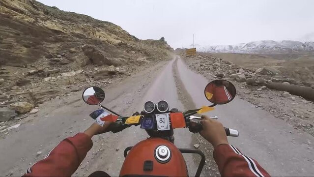 POV of Riding Motor bike on dangerous Himalayan roads with landslide in Spiti Valley of Nako Himachal Pradesh India