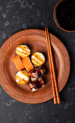 Sushi and rolls cooked on the table
