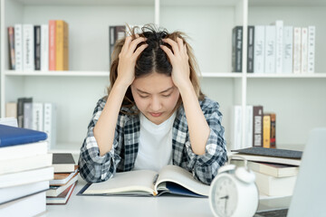 Asian student woman have anxiety because of exams, female prepare for test and learning lessons in...