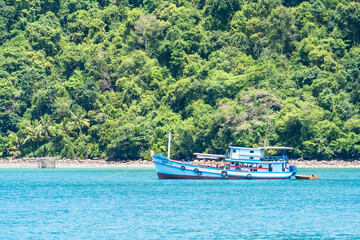 Trat, Thailand - July, 17, 2023 : The Asian fishing boat in the sea at Koh Kood, Trat Province Thailand.