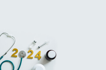 Happy new year 2024 for health care and medical concept.Golden wood numbers with...
